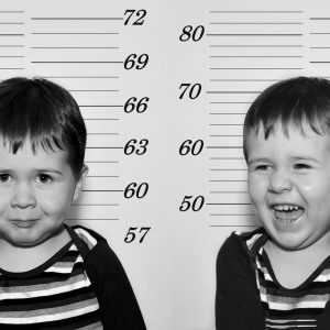 Concept,Of,An,Arrest,With,A,Toddler,With,A,Mugshot